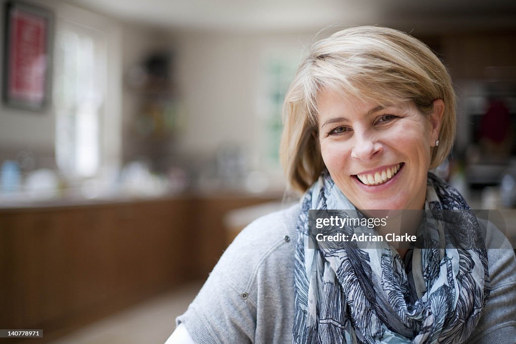 Smiling woman in kitchen