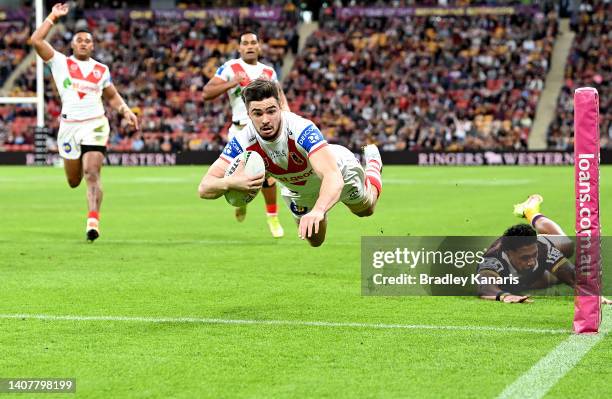 Cody Ramsey of the Dragons dives over to score a try during the round 17 NRL match between the Brisbane Broncos and the St George Illawarra Dragons...