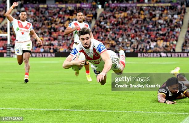 Cody Ramsey of the Dragons dives over to score a try during the round 17 NRL match between the Brisbane Broncos and the St George Illawarra Dragons...