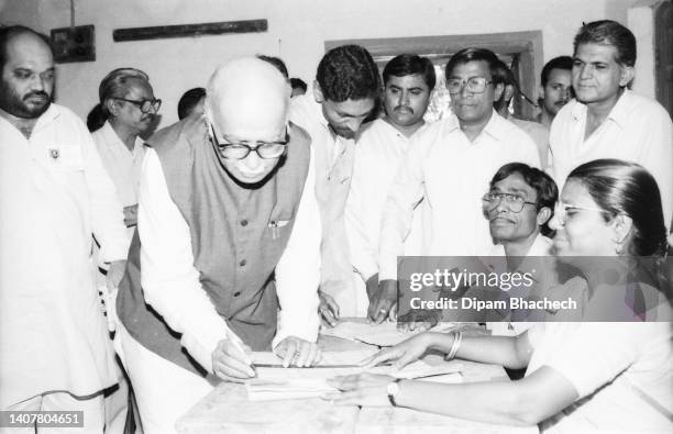 Lal Krishna Advani, Ex Deputy Prime Minister of India, casting vote at Ahmedabad Gujarat India with Amit Shah, Home Minister of India, and Anandiben...