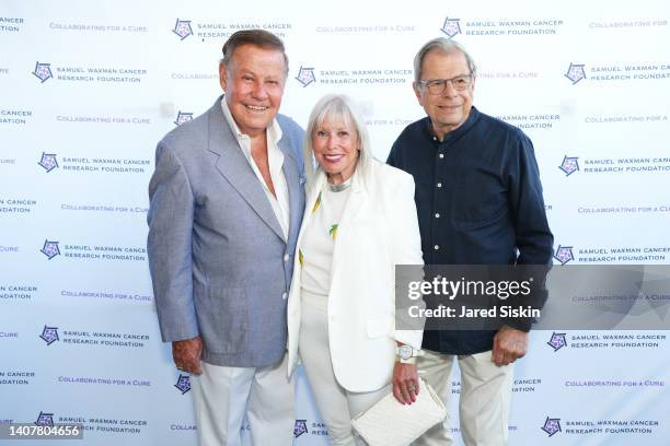 Marvin Scott, Lorri Scott and Samuel Waxman attend The Samuel Waxman 18th Annual Hamptons Happening on July 09, 2022 in Bridgehampton, New York.