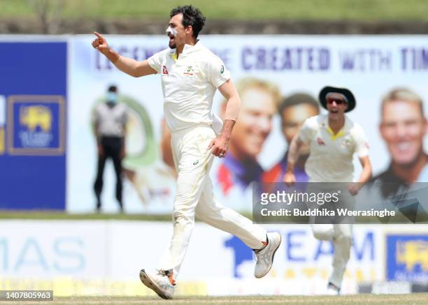 Mitchell Starc of Australia celebrates after taking the wicket of Angelo Mathews of Sri Lanka during day three of the Second Test in the series...