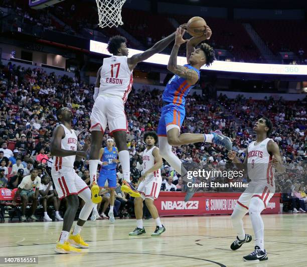 Tari Eason of the Houston Rockets blocks a shot by Tre Mann of the Oklahoma City Thunder during the 2022 NBA Summer League at the Thomas & Mack...