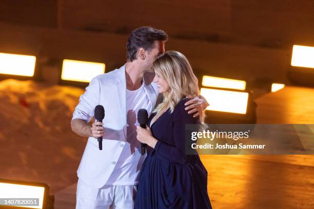 Florian Silbereisen and Beatrice Egli are seen on stage during the TV show "Die grosse Schlagerstrandparty 2022" on July 09, 2022 in Gelsenkirchen,...