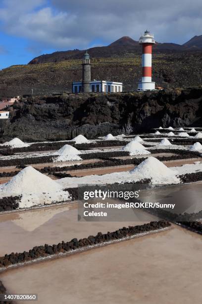 crystal pools and salt mountains in the fuencaliente salt flats at punta de fuencaliente, lighthouses at the southern tip of the island, la palma, canary island, spain - salt flat stock illustrations