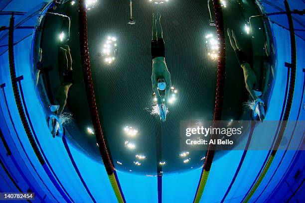 James May Disney of Millfield School, Craig Gibbons of Maxwell, and Braxston Timm of City of Sheffield start the Mens 100 Freestyle Semi Final during...