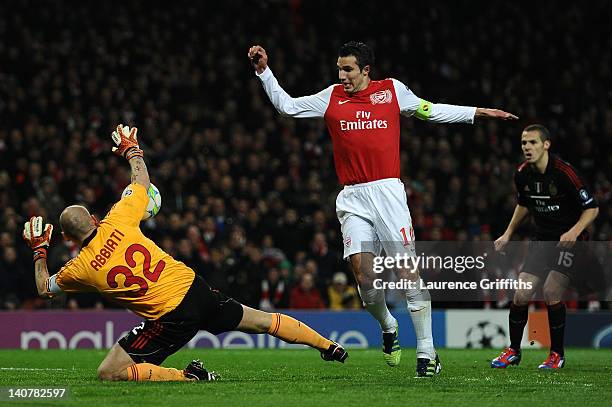 Christian Abbiati of AC Milan saves Robin van Persie of Arsenal's close range effort on goal during the UEFA Champions League Round of 16 second leg...