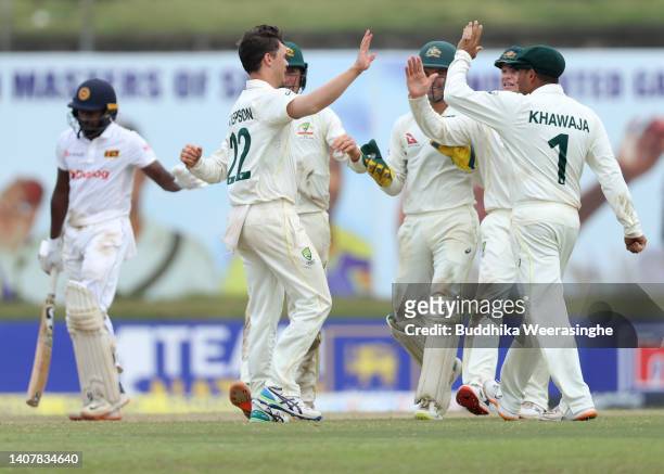 Mitchell Swepson of Australia celebrates with teammates after taking the wicket of Kamindu Mendis of Sri Lanka during day three of the Second Test in...