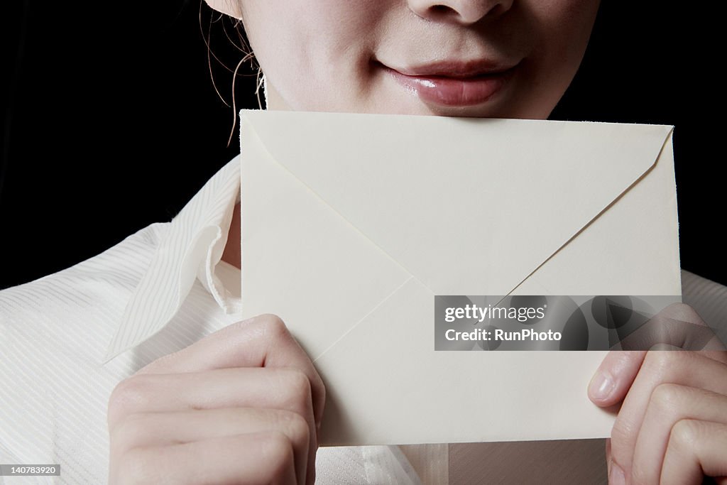 Woman with envelope,close-up