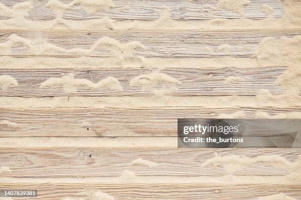 full frame shot of boardwalk with sand - boardwalk stockfoto's en -beelden