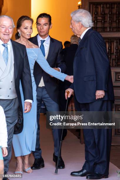Isabel Preysler, Julio Jose Iglesias and Mario Vargas Llosa leave the church after the wedding of Alvaro Castillejo and Cristina Fernandez, on July 9...