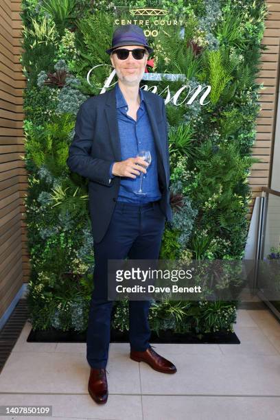 Stephen Merchant celebrates with Champagne Lanson at The Championships at Wimbledon on July 10, 2022 in London, England.