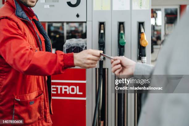 gas station work - working oil pumps stock pictures, royalty-free photos & images