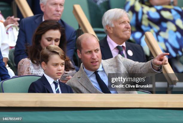 Prince William, Duke of Cambridge and Prince George of Cambridge are seen in the Royal Box watching Novak Djokovic of Serbia play Nick Kyrgios of...