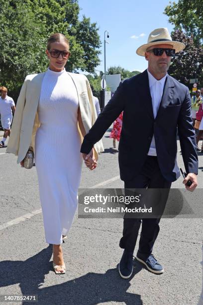 Jason Statham and Rosie Huntington Whiteley arrive for Men's Singles Final Day at All England Lawn Tennis and Croquet Club on July 10, 2022 in...