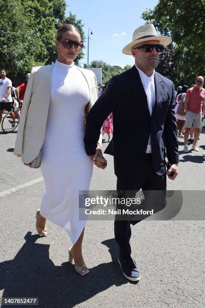 Jason Statham and Rosie Huntington Whiteley arrive for Men's Singles Final Day at All England Lawn Tennis and Croquet Club on July 10, 2022 in...