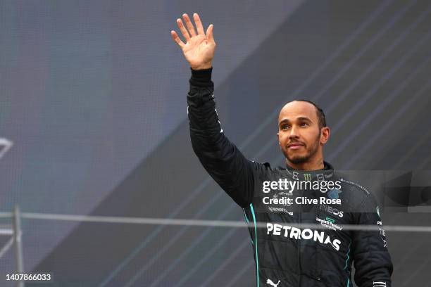 Third placed Lewis Hamilton of Great Britain and Mercedes celebrates on the podium during the F1 Grand Prix of Austria at Red Bull Ring on July 10,...