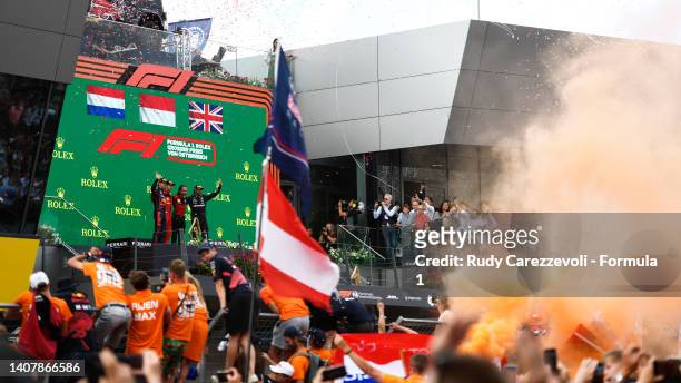 Race winner Charles Leclerc of Monaco and Ferrari, Second placed Max Verstappen of the Netherlands and Oracle Red Bull Racing, Third placed Lewis...