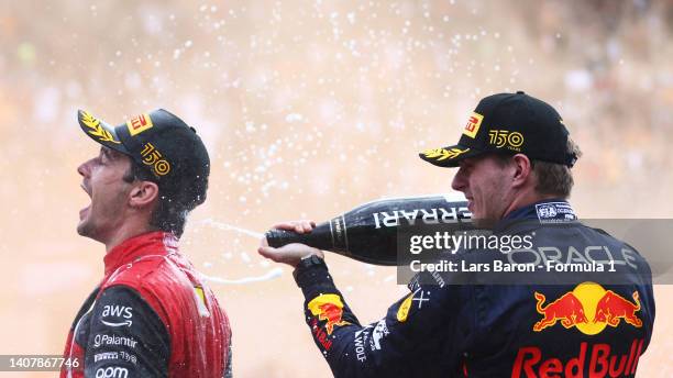 Race winner Charles Leclerc of Monaco and Ferrari and Second placed Max Verstappen of the Netherlands and Oracle Red Bull Racing celebrate on the...