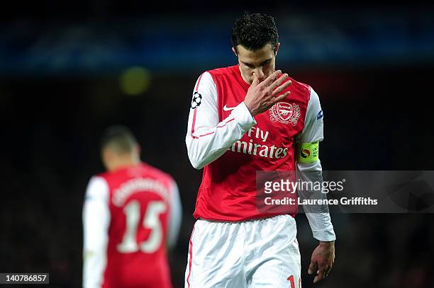 Robin van Persie of Arsenal looks dejected during the UEFA Champions League Round of 16 second leg match between Arsenal and AC Milan at Emirates...