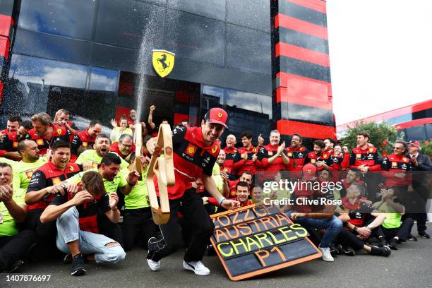 Race winner Charles Leclerc of Monaco and Ferrari celebrates with his team after the F1 Grand Prix of Austria at Red Bull Ring on July 10, 2022 in...