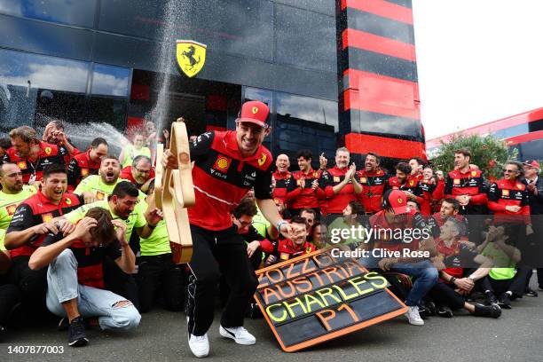 Race winner Charles Leclerc of Monaco and Ferrari celebrates with his team after the F1 Grand Prix of Austria at Red Bull Ring on July 10, 2022 in...
