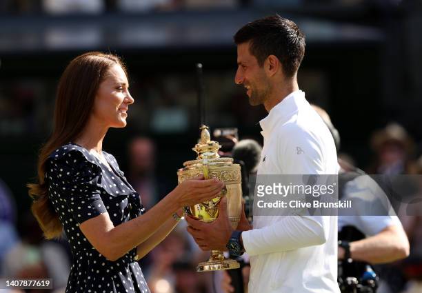 Catherine, Duchess of Cambridge hands over the trophy to winner Novak Djokovic of Serbia following his victory against Nick Kyrgios of Australia...