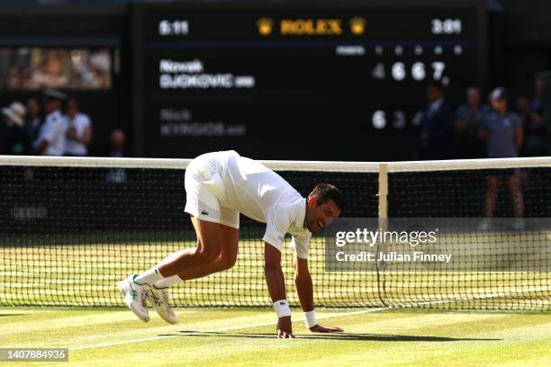 Novak Djokovic of Serbia celebrates winning match point against Nick Kyrgios of Australia during their Men's Singles Final match on day fourteen of...