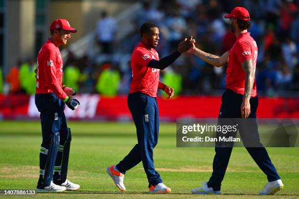 Chris Jordan and Reece Topley of England celebrate victory after the 3rd Vitality IT20 match between England and India at Trent Bridge on July 10,...