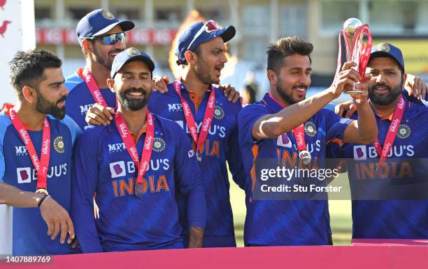 India players celebrate the series win with the trophy after the third Vitality T20 match between England and India at Trent Bridge on July 10, 2022...