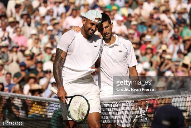 Winner Novak Djokovic of Serbia and runner up Nick Kyrgios of Australia interact by the net following their Men's Singles Final match day fourteen of...