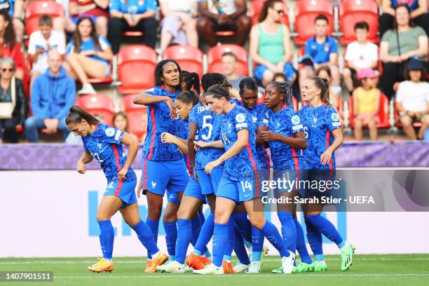 Grace Geyoro of France celebrates with teammates after scoring their team's first goal during the UEFA Women's Euro 2022 group D match between France...