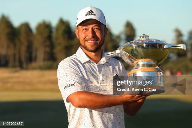 Xander Schauffele of the United States poses with the trophy after winning the Genesis Scottish Open at The Renaissance Club on July 10, 2022 in...