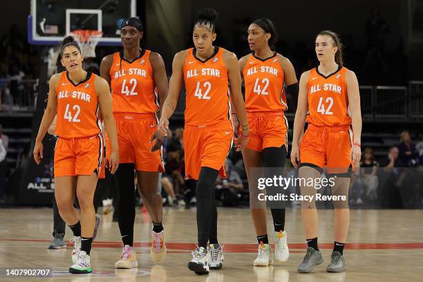 Kelsey Plum, Sylvia Fowles, Candace Parker, A'ja Wilson and Sabrina Ionescu of Team Wilson walk to the bench during the 2022 AT&T WNBA All-Star Game...