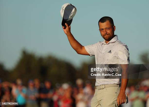 Xander Schauffele of the United States celebrates on the 18th green after winning the Genesis Scottish Open at The Renaissance Club on July 10, 2022...