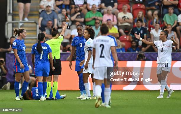 Sara Gama of Italy fouls Grace Geyoro of France and is shown a red card by match referee Rebecca Welch which is later overturned following a VAR...