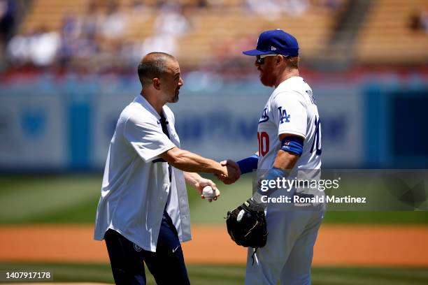 Joe Cole of Chelsea F.C. And Justin Turner of the Los Angeles Dodgers greet after the ceremonial first pitch before a game between the Chicago Cubs...