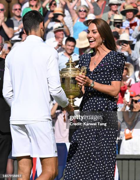 Catherine, Duchess of Cambridge presents Novak Djokovic with the Wimbledon Trophy after winning the Wimbledon Men's Singles Final at All England Lawn...