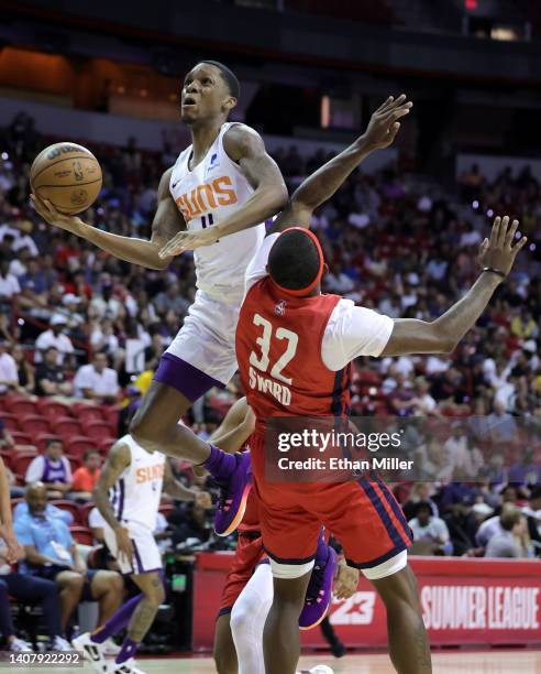 Tyson Carter of the Phoenix Suns is fouled as he drives to the basket by Craig Sword of the Washington Wizards during the 2022 NBA Summer League at...