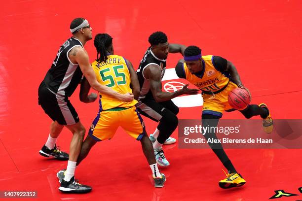 Quincy Miller of the 3 Headed Monsters drives past Sek Henry of the Enemies during the game in BIG3 Week Four at Comerica Center on July 10, 2022 in...