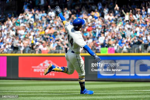 Julio Rodriguez of the Seattle Mariners celebrates after hitting a one run single and advances a runner during the fifth inning against the Toronto...