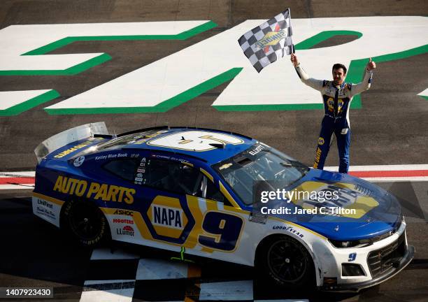Chase Elliott, driver of the NAPA Auto Parts Chevrolet, celebrates after winning the NASCAR Cup Series Quaker State 400 at Atlanta Motor Speedway on...