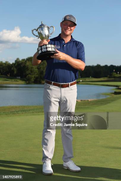 Trey Mullinax of the United States poses with the trophy after winning the Barbasol Championship at Keene Trace Golf Club on July 10, 2022 in...