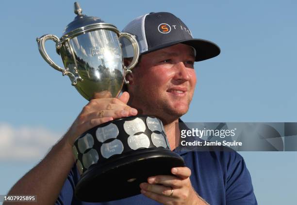 Trey Mullinax of the United States poses with the trophy after winning the Barbasol Championship at Keene Trace Golf Club on July 10, 2022 in...