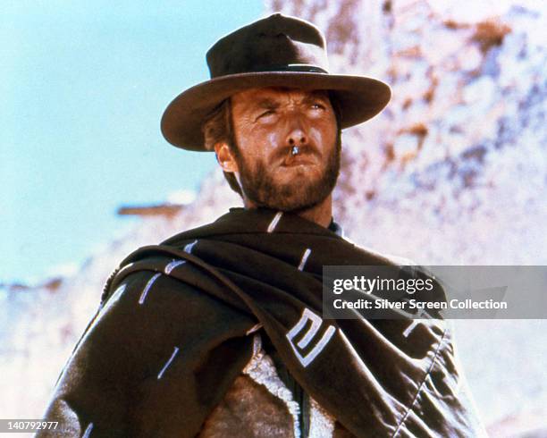 Clint Eastwood, US actor, smoking a cigar, wearing a brown hat and poncho in a publicity portrait issued for the film, 'A Fistful of Dollars', Spain,...
