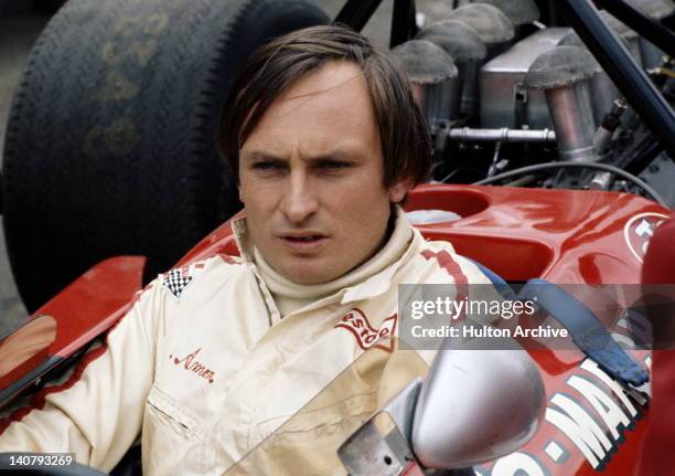 Chris Amon of New Zealand, driver of the March Engineering March 701 Cosworth V8 before the start of the British Grand Prix 18th July 1970 at the...