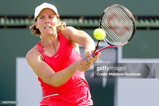 Greta Arn of Hungary returns a shot to Julia Cohen during qualifying for the BNP Paribas Open at the Indian Wells Tennis Garden on March 6, 2012 in...