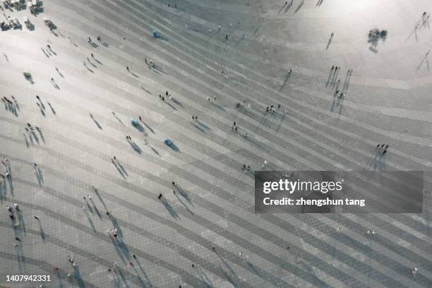 aerial view of a crowd in city square at night. - berlin business imagens e fotografias de stock