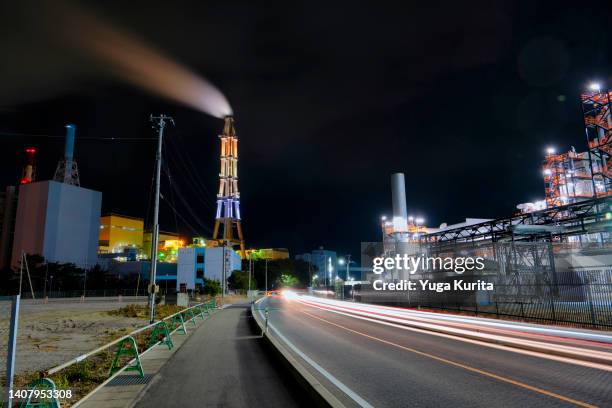 cars running through thermal power stations at night - iwaki fukushima fotografías e imágenes de stock