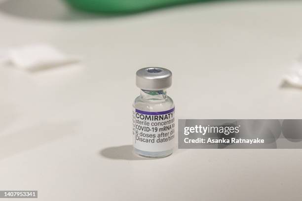 Vile of a Pfizer-BioNTech COVID-19 mRNA vaccine is seen at Exhibition Pharmacy on July 11, 2022 in Melbourne, Australia. More Australians are now...